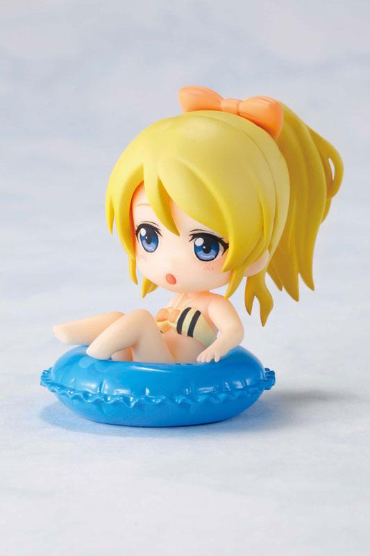 坐在泳圈里的绚濑绘里黄色泳装手办的左侧面