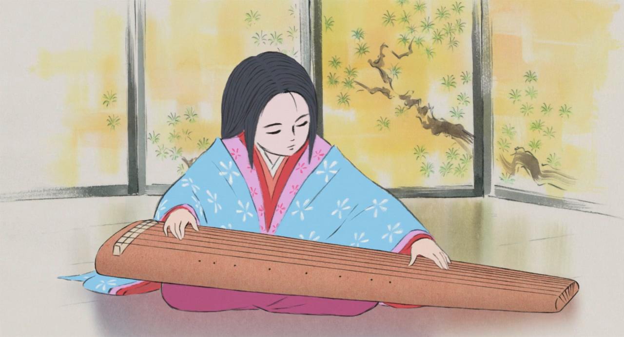 正在弹琴弹古筝的小女孩