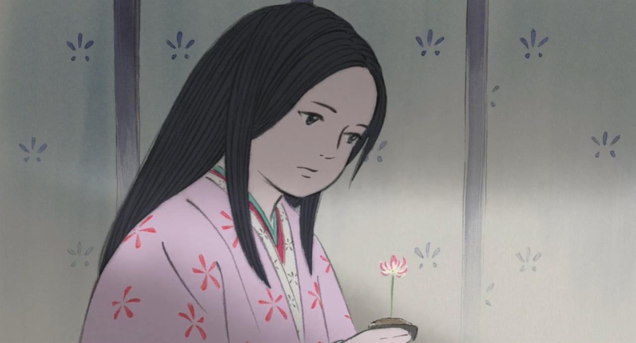 小女孩捧着一盆小花